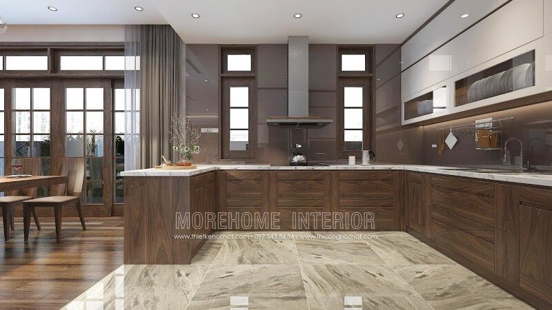 Thiết kế tủ bếp biệt thự cao cấp với gỗ óc chó chủ đạo kết hợp gỗ công nghiệp Acrylic nhẹ nhàng, phần mặt bếp được ốp đá nhân tạo vân mây tạo nên một không gian hoàn mỹ, sang trọng và vô cùng sạch sẽ